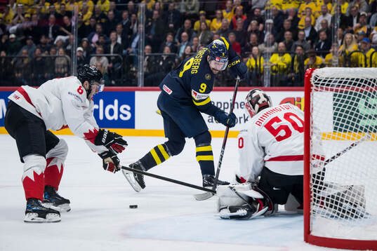 Filip Forsberg of Sweden against Noah Dobson and goaltender