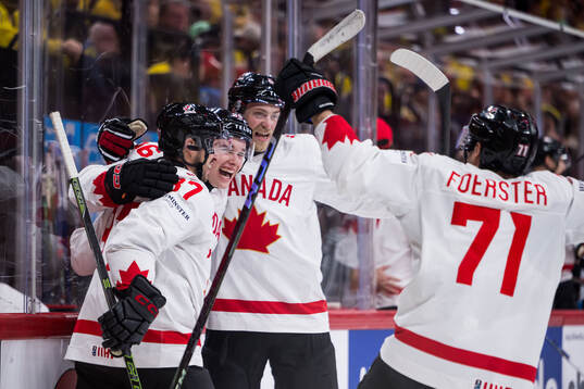 Macklin Celebrini of Canada celebrates