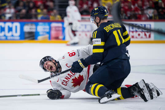Sidney Crosby of Canada and Mikael Backlund of Sweden
