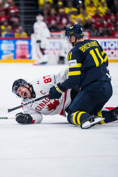 Sidney Crosby of Canada and Mikael Backlund of Sweden