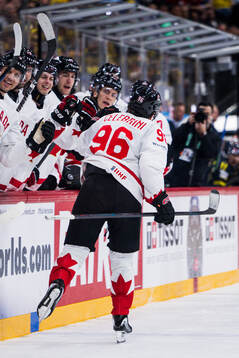 Macklin Celebrini of Canada celebrates the 2-4 goal