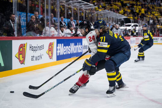 Phillip Danault of Canada and William Karlsson of Sweden