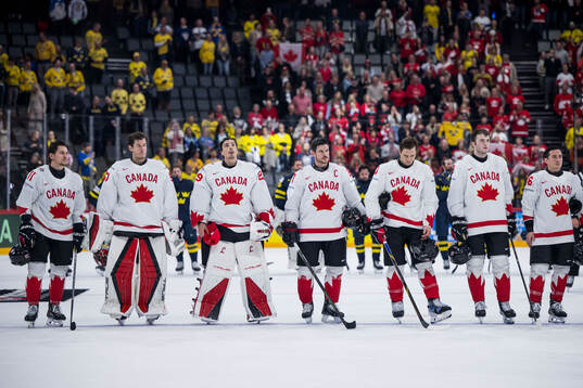 Marc-André Fleury and Sidney Crosby of Canada