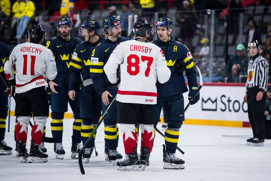 Sidney Crosby of Canada and Mikael Backlund of Sweden