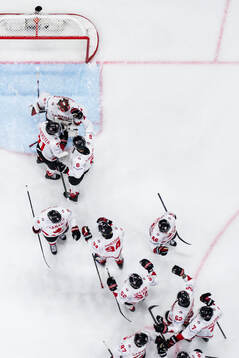 Goaltender Jordan Binnington of Canada celebrate with