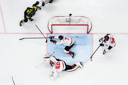 Goaltender Jordan Binnington and Mike Matheson of Canada