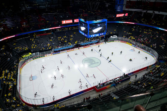 Players of Canada and of Sweden warm-ups