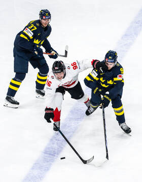 Macklin Celebrini of Canada against Isac Lundeström and