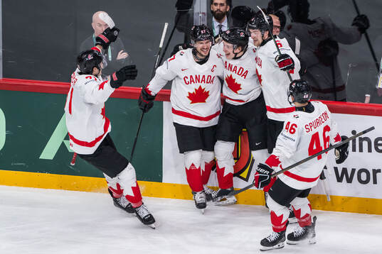 Sidney Crosby, Macklin Celebrini and Travis Sanheim of