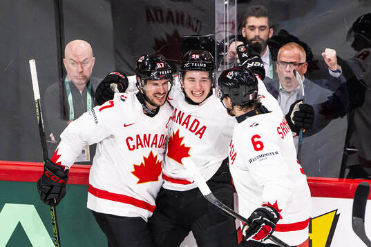 Sidney Crosby , Macklin Celebrini and Travis Sanheim of