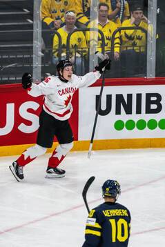 Macklin Celebrini of Canada celebrates the 2-4 goal