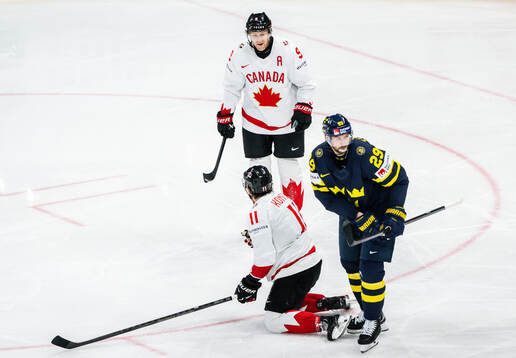 Nathan MacKinnon and Travis Konecny of Canada celebrate the