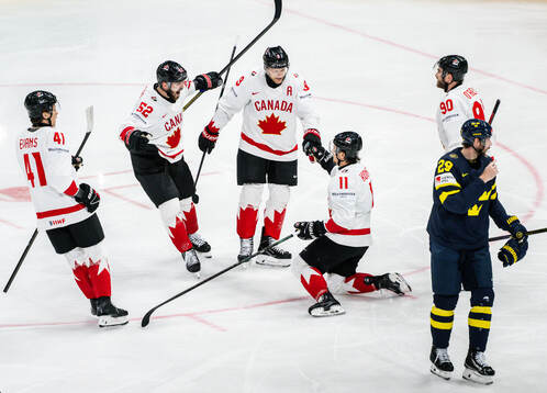 Ryker Evans , MacKenzie Weegar , Nathan MacKinnon , Travis