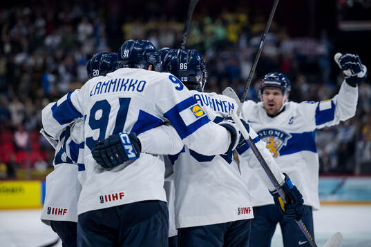 Patrik Puistola of Finland celebrates with Eeli Tolvanen,