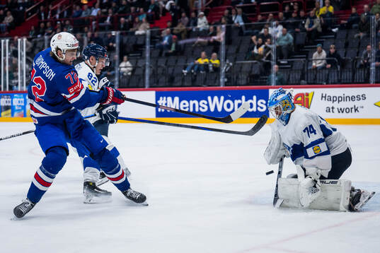 Tage Thompson of USA and goaltender Juuse Saros of Finland