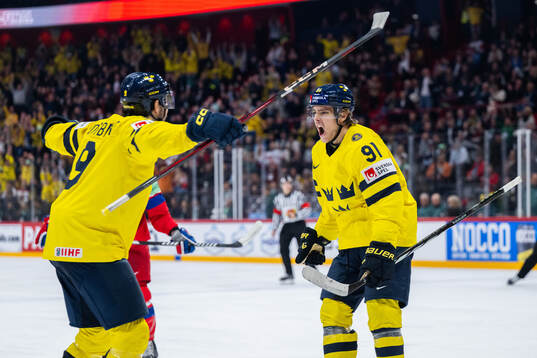 Filip Forsberg and Leo Carlsson of Sweden celebrate