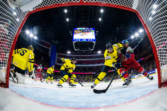 Goaltender Jacob Markström, Mikael Backlund and Adam