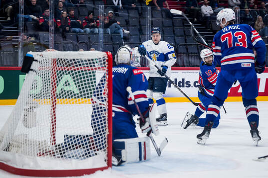 Eeli Tolvanen of Finland scores 1-1 behind goaltender