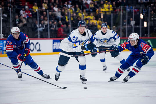 Nikolas Matinpalo of Finland against Tage Thompson and Zeev