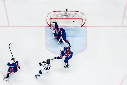 Zach Werenski, Zeev Buium and goaltender Jeremy Swayman of