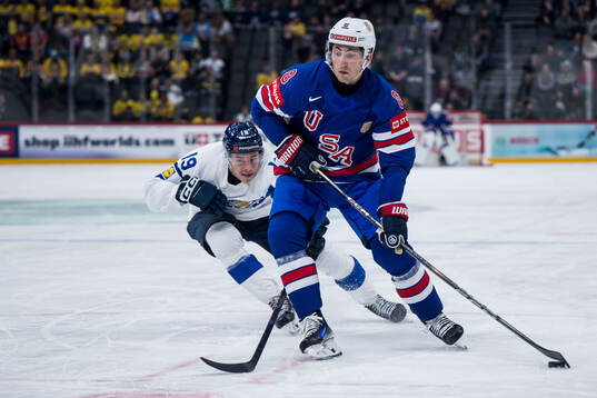 Waltteri Merelä of Finland and Zach Werenski of USA