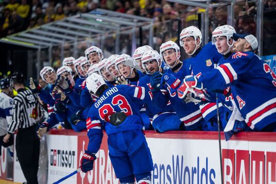 Conor Garland of USA celebrates with teammates