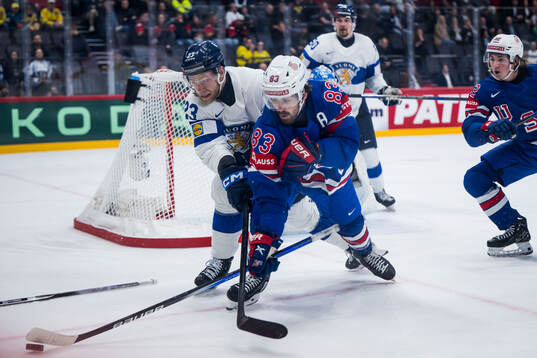 Nikolas Matinpalo of Finland and Conor Garland of USA