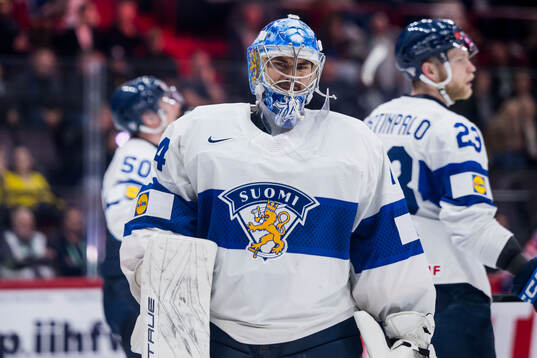 Goaltender Juuse Saros of Finland looks dejected