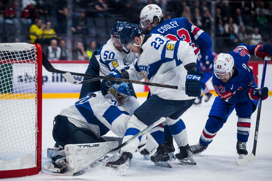 Goaltender Juuse Saros, Nikolas Matinpalo, and Mikael