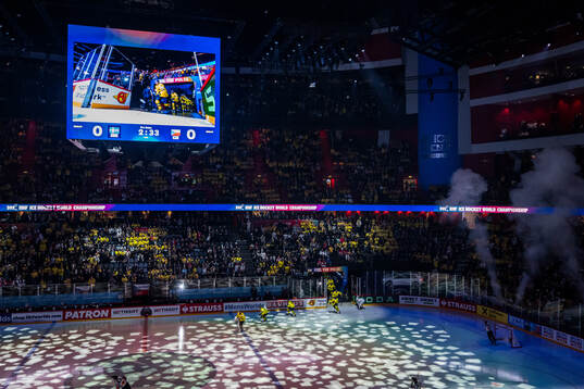 Players of Sweden enter the ice