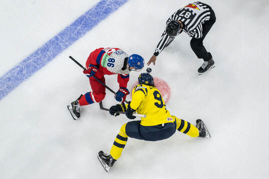 Petr Kodytek of Czech Republic and Mika Zibanejad of Sweden
