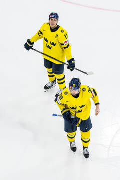 Mikael Backlund and Rasmus Sandin of Sweden looks dejected