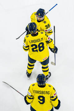 Rasmus Sandin, Elias Lindholm, and Filip Forsberg of Sweden