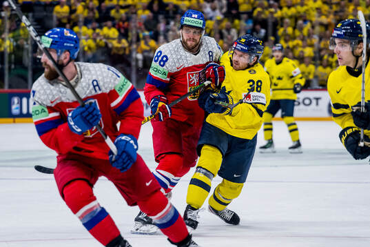 David Pastrnak of Czech Republic and Rasmus Sandin of Sweden
