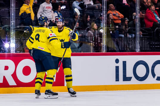 Filip Forsberg and Marcus Pettersson of Sweden celebrate