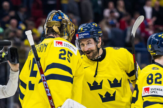 Jacob Markström and Filip Forsberg of Sweden celebrate