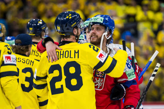 Elias Lindholm of Sweden and David Pastrnak of Czech
