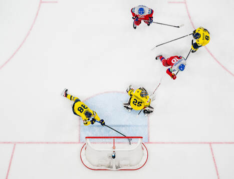 Rasmus Sandin with a save behind goaltender Jacob