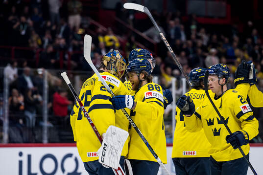William Nylander and Lucas Raymond celebrate with