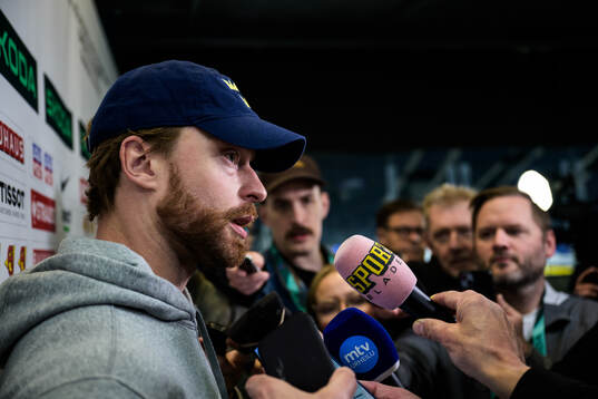 Adam Larsson of Sweden is being interviewed by media at a