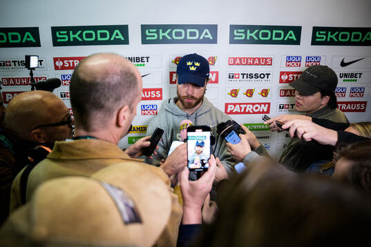 Adam Larsson of Sweden is being interviewed by media at a