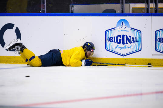 William Nylander of Sweden slips at a practice session
