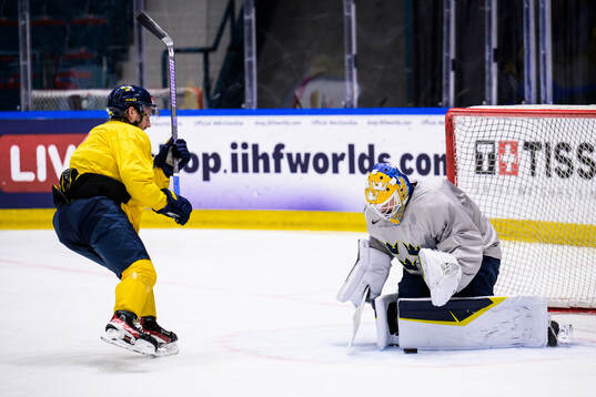 Rasmus Sandin and goalkeeper Arvid Söderblom of Sweden at