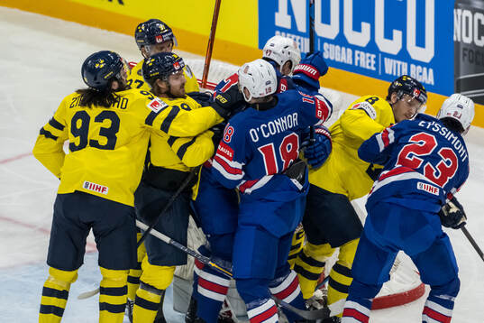 Drew O'Connor, Michael McCarron, and Michael Eyssimont of