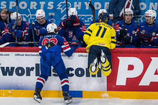 Logan Cooley of USA and Mikael Backlund of Sweden