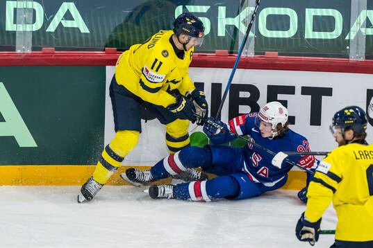Mikael Backlund of Sweden and Logan Cooley of USA
