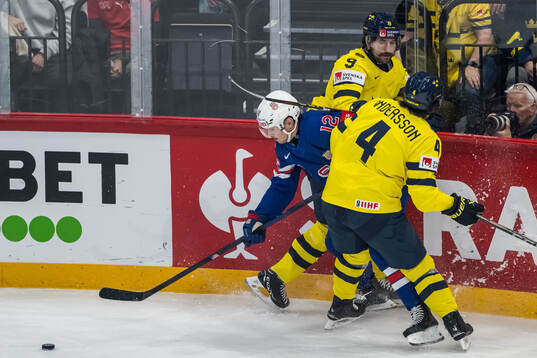Shane Pinto of USA against Filip Forsberg and Rasmus