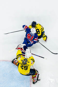 Rasmus Sandin and goaltender Jacob Markström of Sweden are