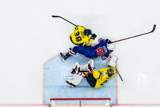 Rasmus Sandin and goaltender Jacob Markström of Sweden are