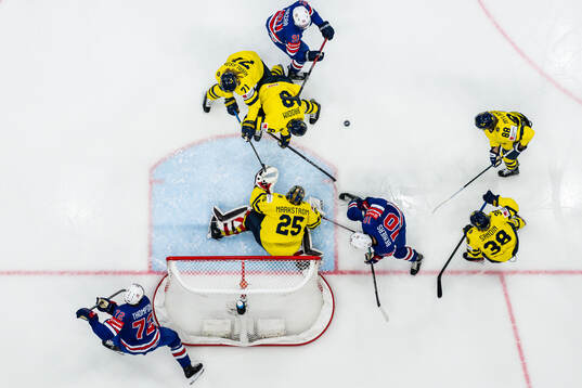 Tage Thompson, Frank Nazar and Matty Beniers of USA in